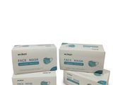 three boxes of face mask on a white background