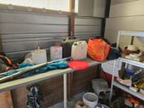 many items on the table in the garage