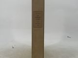 an old book sitting on top of a snow covered ground