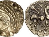 a close up of a coin with an image of a horse on it