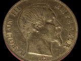 l'image d'une pièce d'or sur laquelle figure le visage d'une femme