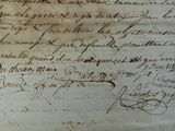 an old document with writing on it sitting on top of a table