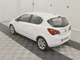 a picture of a white car parked in a garage