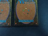 two decks of magic the gathering deck are sitting on a table