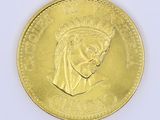 a gold coin with a picture of a queen on it