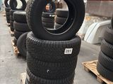 tires are stacked on pallets in a warehouse with pallets of pallets