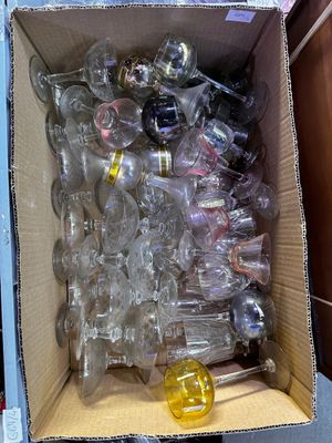 a cardboard box full of empty plastic bottles and a yellow object