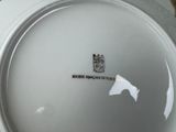a white plate with a black and white design on it