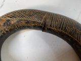 a close up of a wooden object on a table
