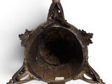 a metal object that is on a white surface