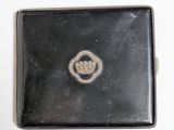a small black box with a silver buckle on it