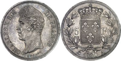 a close up of a coin with a crown on top of it