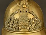 a gold helmet with a crown on top of it