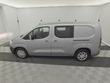 a picture of a silver van parked in a garage