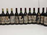 several bottles of wine are lined up on a table