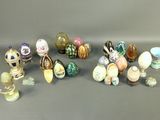 many different types of glass vases on the table