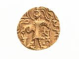une vieille pièce d'or sur laquelle figurent un homme et une femme