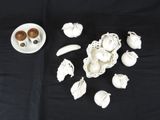 a black table with a plate of food and a bowl of doughnuts on it