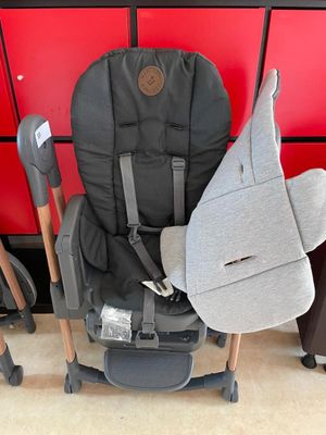 a stroller with a seat that has a bag attached to it