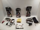 a lot of electronic items on a white table