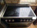 a stove with a glass top in a kitchen