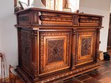a large wooden cabinet in the middle of a room