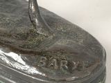 bronze statue of a horse on a base on a white surface