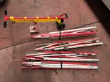 a lot of skis and ski poles on the ground