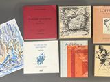 a lot of books that are on a table
