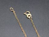 a pair of gold plated chain with a heart charm