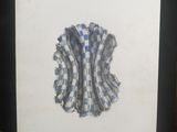 une image représentant une photo encadrée d'une pomme à carreaux bleus et blancs