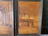 two framed pictures of a street with a bridge and a building