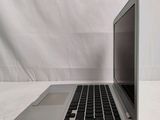 an open laptop computer sitting on top of a white table
