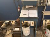 an image of a work station with a lot of work on it