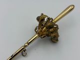 gold plated flower brooch pin on a white background