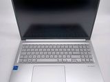 an open laptop computer sitting on top of a white table