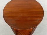 a close up of a table with a wooden top on a white surface