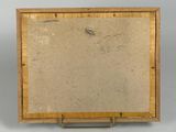 an old picture of a wooden frame with a drawing of a bird on it