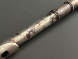 a metal pipe that is sitting on a table