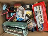 a cardboard box filled with toys and other items