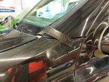 a close up of a car door handle with a sticker on it