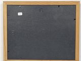 a black and white photo of a wooden frame on a white wall