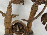 a group of sculptures made out of wood on a white surface