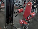 a gym with a lot of machines in the room