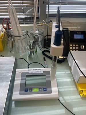 an image of a laboratory table with a microscope and other equipment