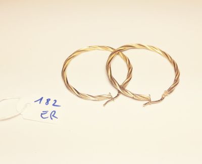 two rings that are sitting on a table next to a pair of scissors
