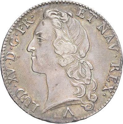 a silver coin with a woman ' s head and long hair
