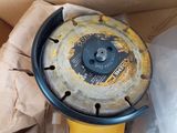 yellow and black tool in a cardboard box on top of a cardboard box
