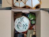 a box full of assorted items sitting on the floor