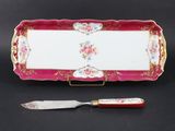 a pink tray with a knife and a knife on it